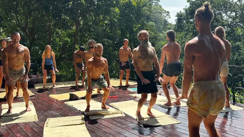 Guests moving together on a sunny wooden deck