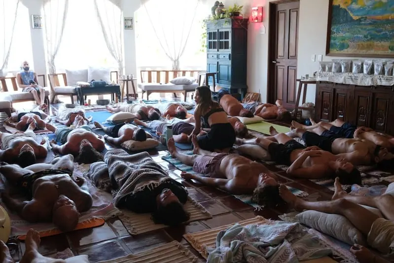 Guests lying on mats during a breathwork session