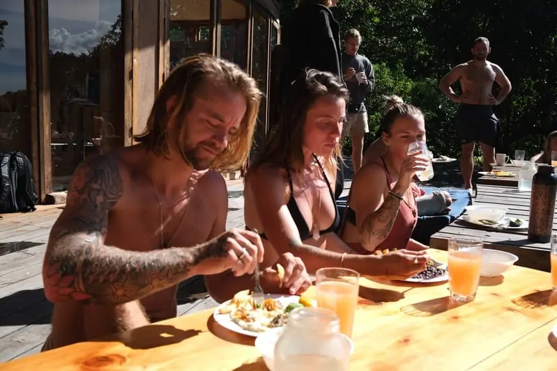 Guests sharing a sunlit breakfast table